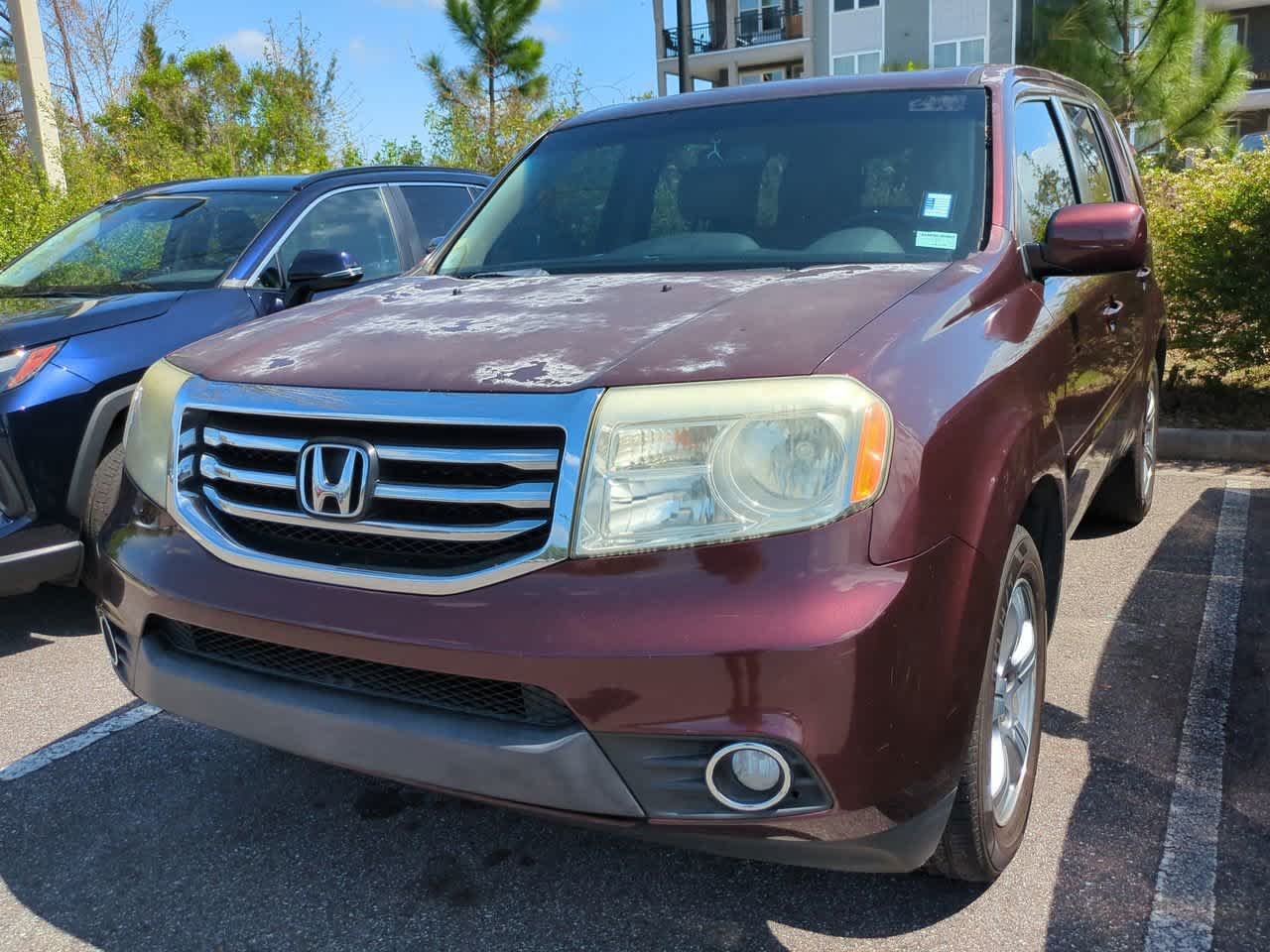 Used 2015 Honda Pilot EX-L with VIN 5FNYF3H59FB011317 for sale in Wesley Chapel, FL