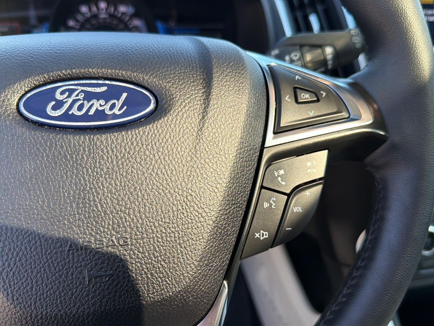 Used 2024 Star White Metallic Tri-Coat Ford Titanium image 23
