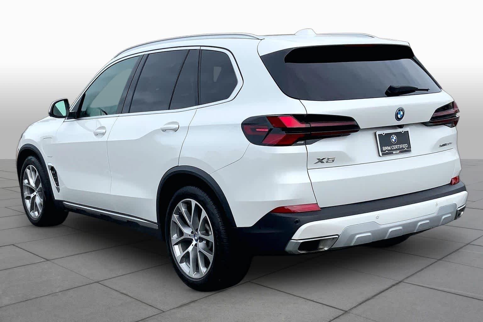 Used 2024 Mineral White Metallic BMW xDrive50e image 11