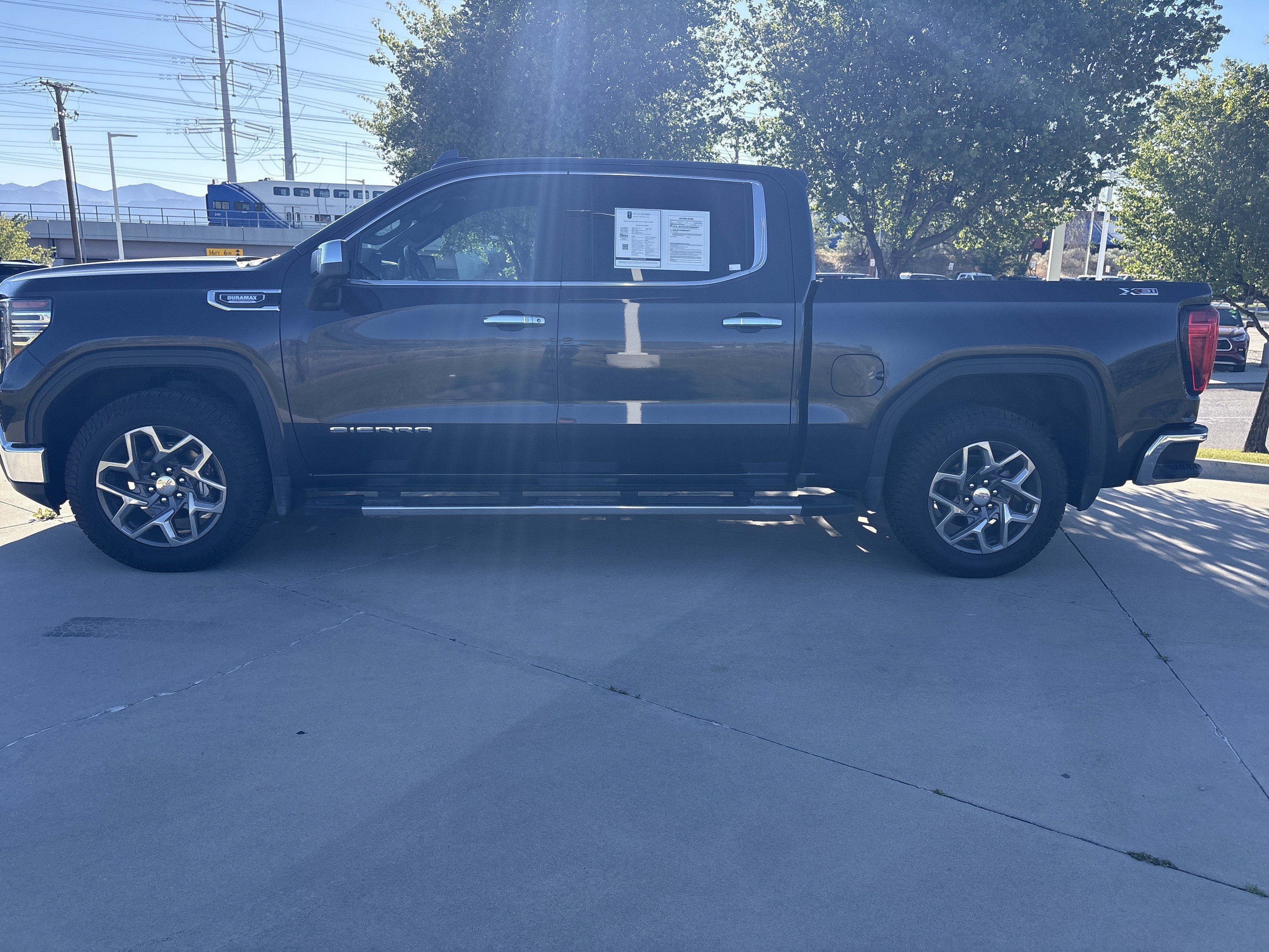 Used 2022 Titanium Rush Metallic GMC SLT image 2
