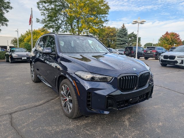 Certified Used 2026 Tanzanite Blue II Metallic BMW xDrive50e image 7