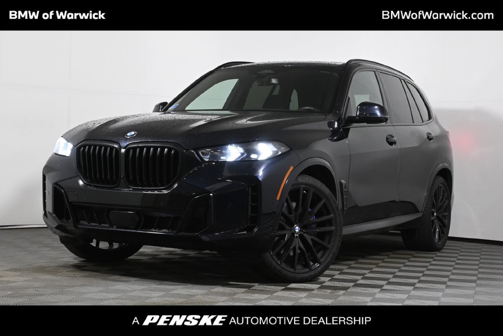 Certified Used 2024 Carbon Black Metallic BMW xDrive40i image 1