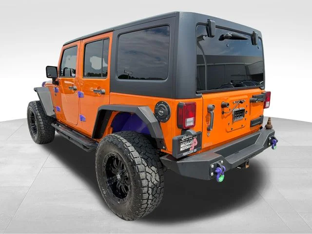 Used 2013 Orange Jeep Unlimited Rubicon image 5