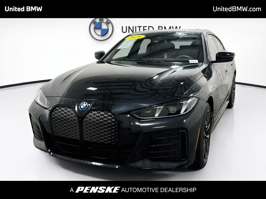 Certified Used 2025 Black Sapphire Metallic BMW eDrive40 image 1