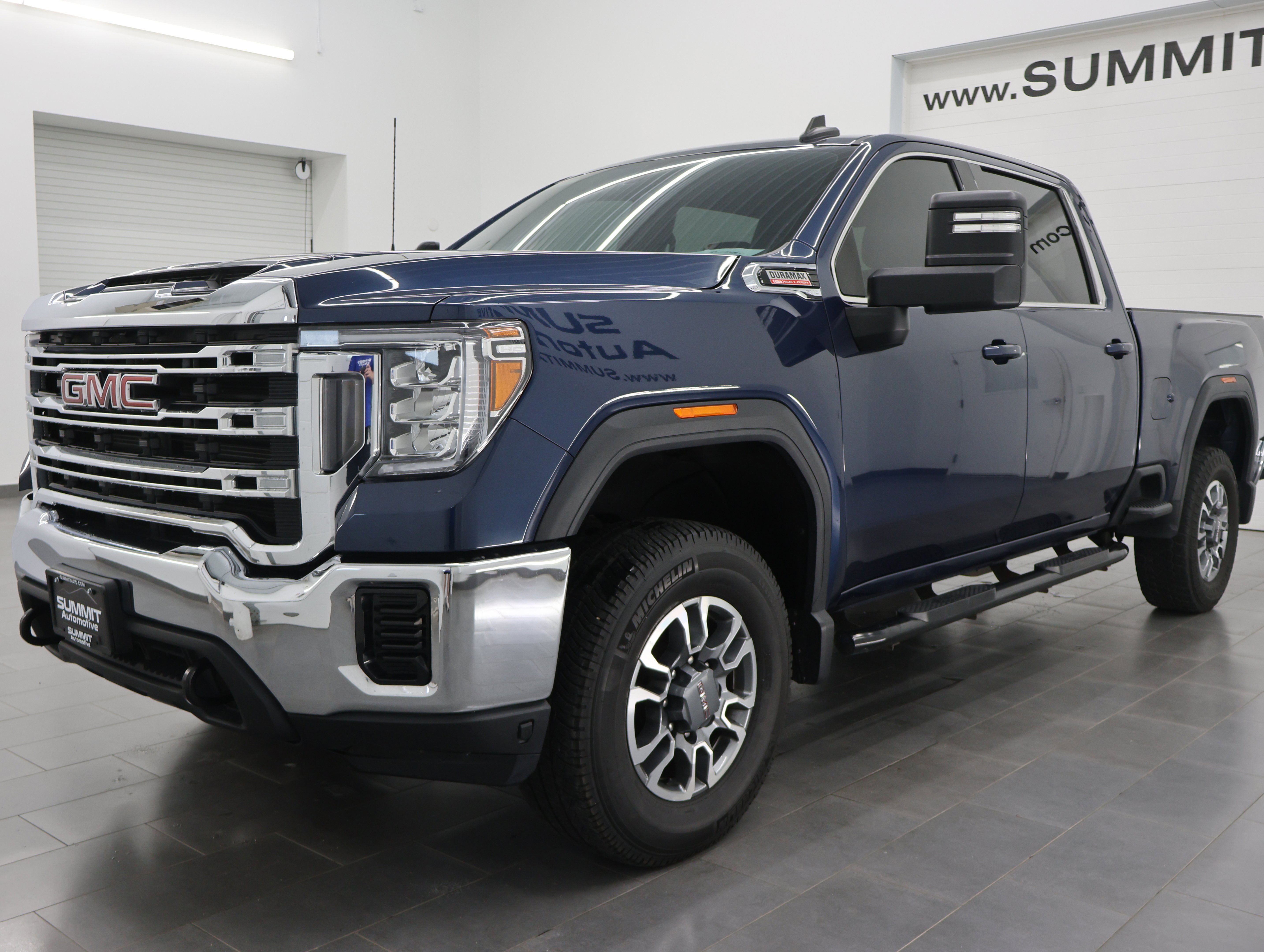 Used 2023 Pacific Blue Metallic GMC 4x4 Crew Cab SLE: CREW-SHORT-SLE-6.6L DIESEL-4WD-BACKUP CAM image 7