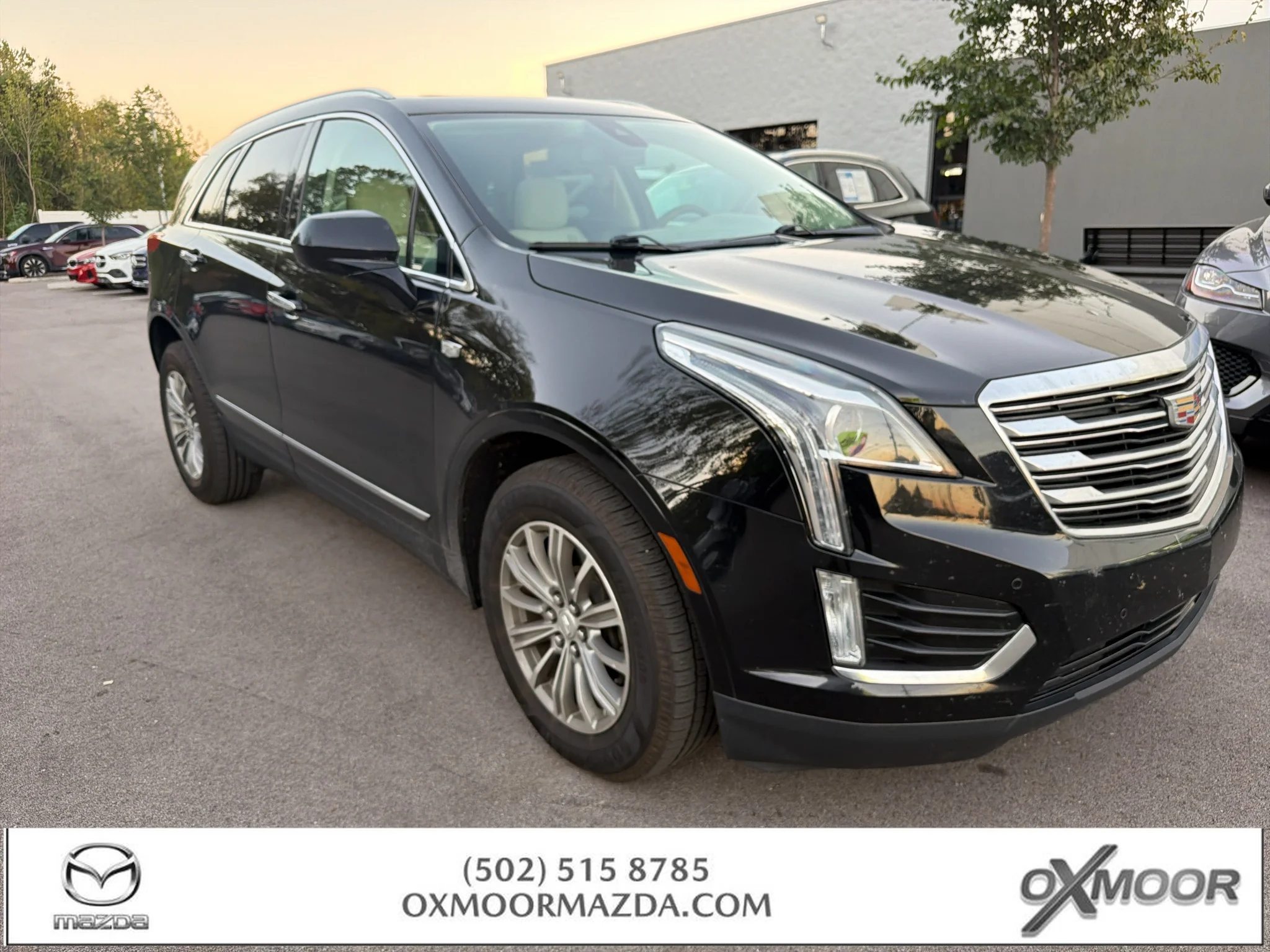 Used 2017 Stellar Black Metallic Cadillac Luxury FWD image 1