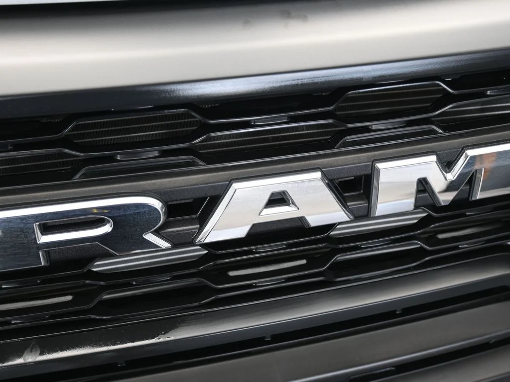Used 2025 Bright Silver Clearcoat Metallic Ram Low Roof image 36