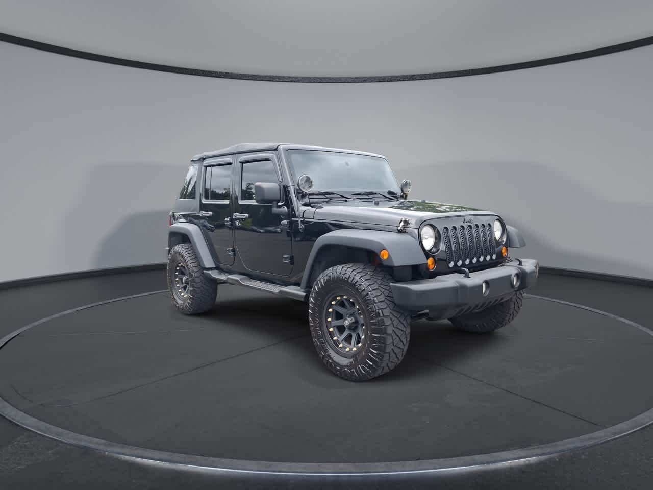 Used 2013 Black Clearcoat Jeep Sport image 2