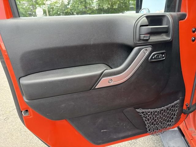 Used 2015 Orange Jeep Sahara image 25