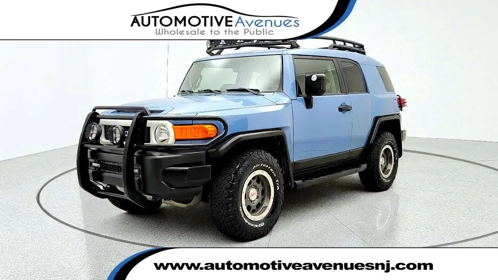 Used 2014 Heritage Blue Toyota 4WD 4dr Automatic image 1