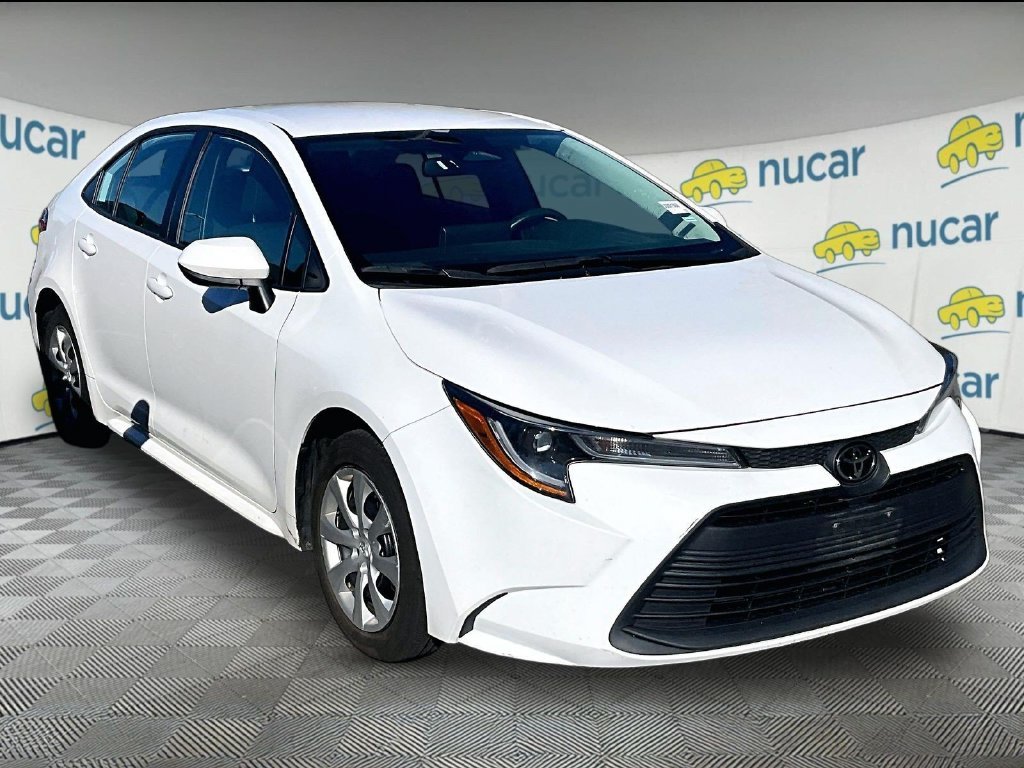Used 2024 White Toyota LE image 1