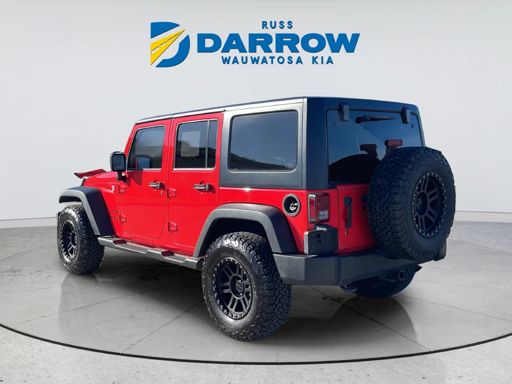 Used 2013 Red Jeep Unlimited Sport image 3