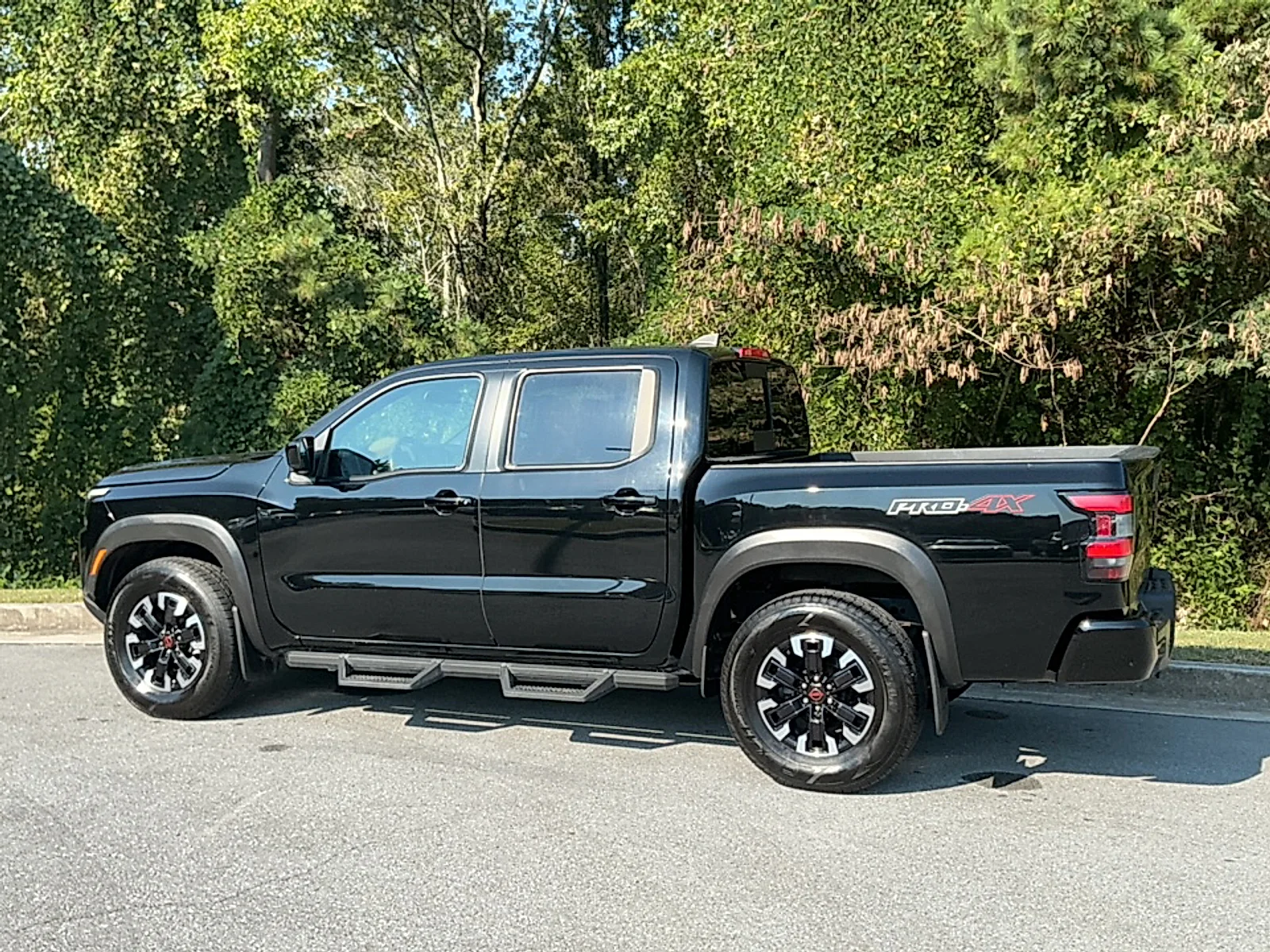 Used 2024 Super Black Nissan Crew Cab PRO-4X 4x4 image 3