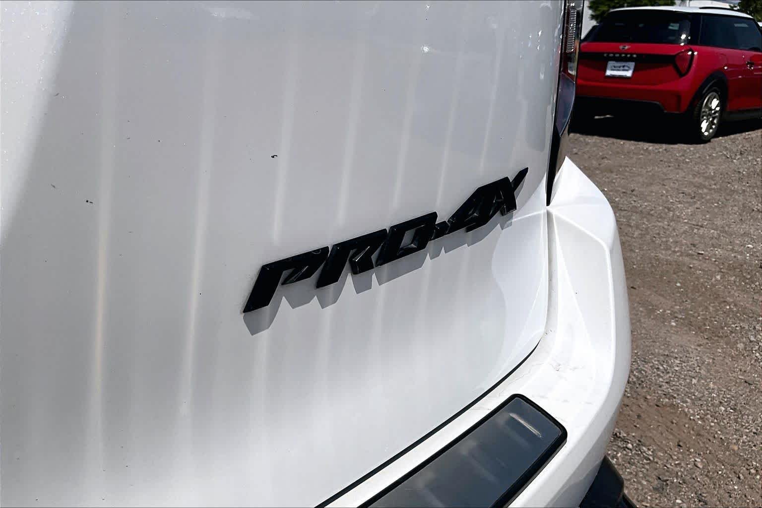 Used 2025 Aspen White Tricoat/Super Black Nissan PRO-4X image 8