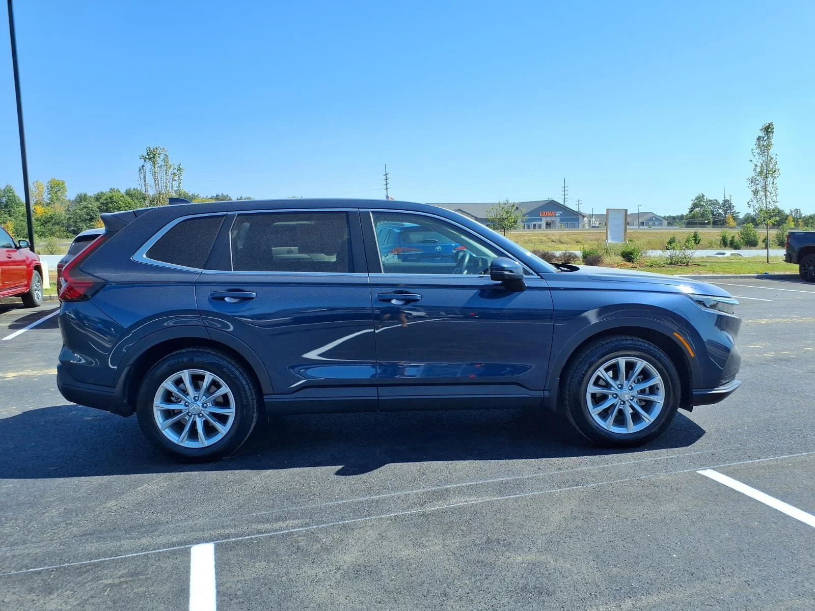 Used 2024 Canyon River Blue Metallic Honda EX-L image 27