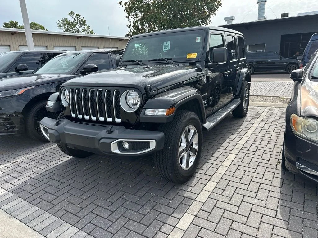 Used 2019 Black Jeep Unlimited Sahara image 1