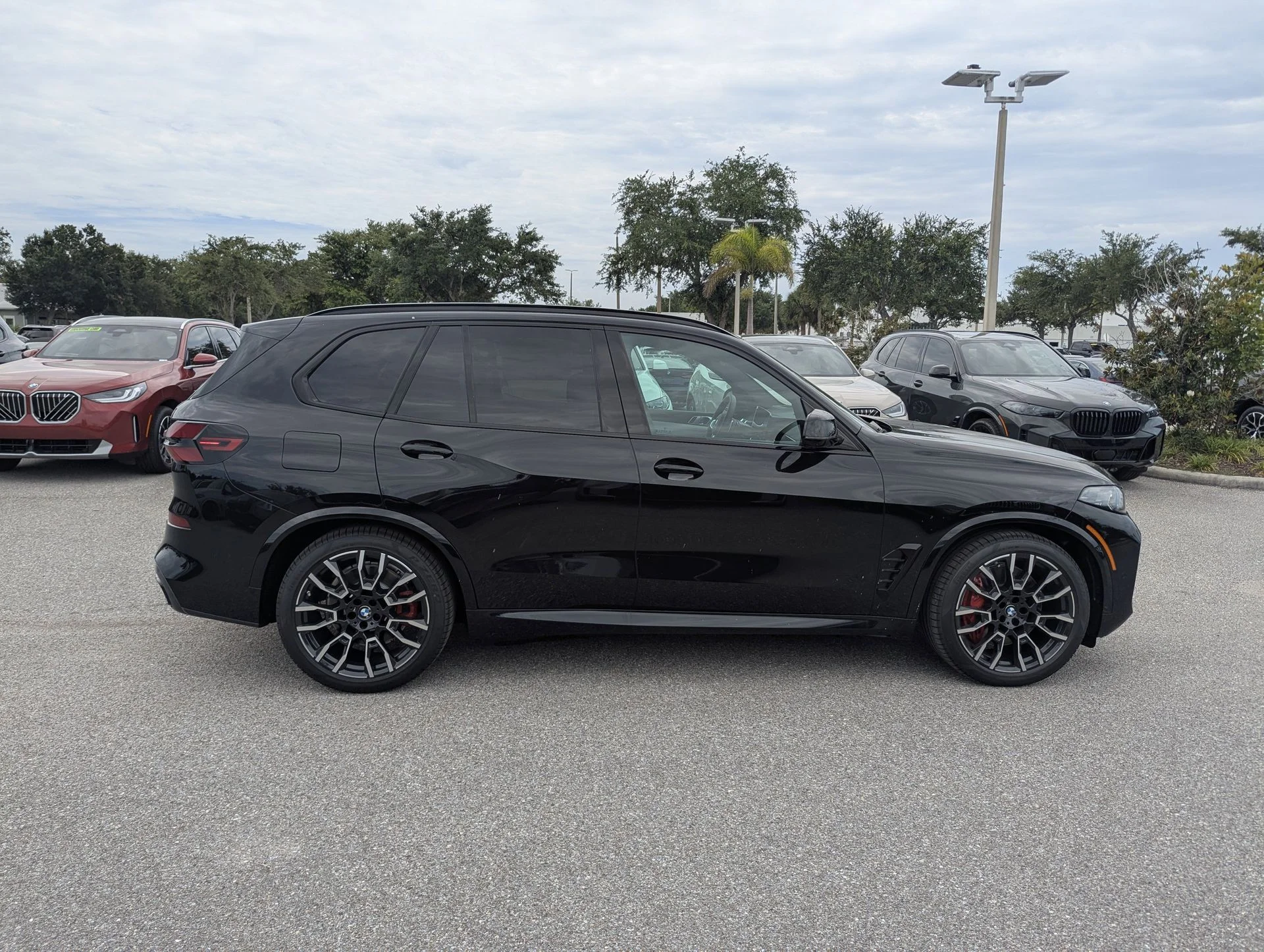 New 2026 Black Sapphire Metallic BMW xDrive50e image 8