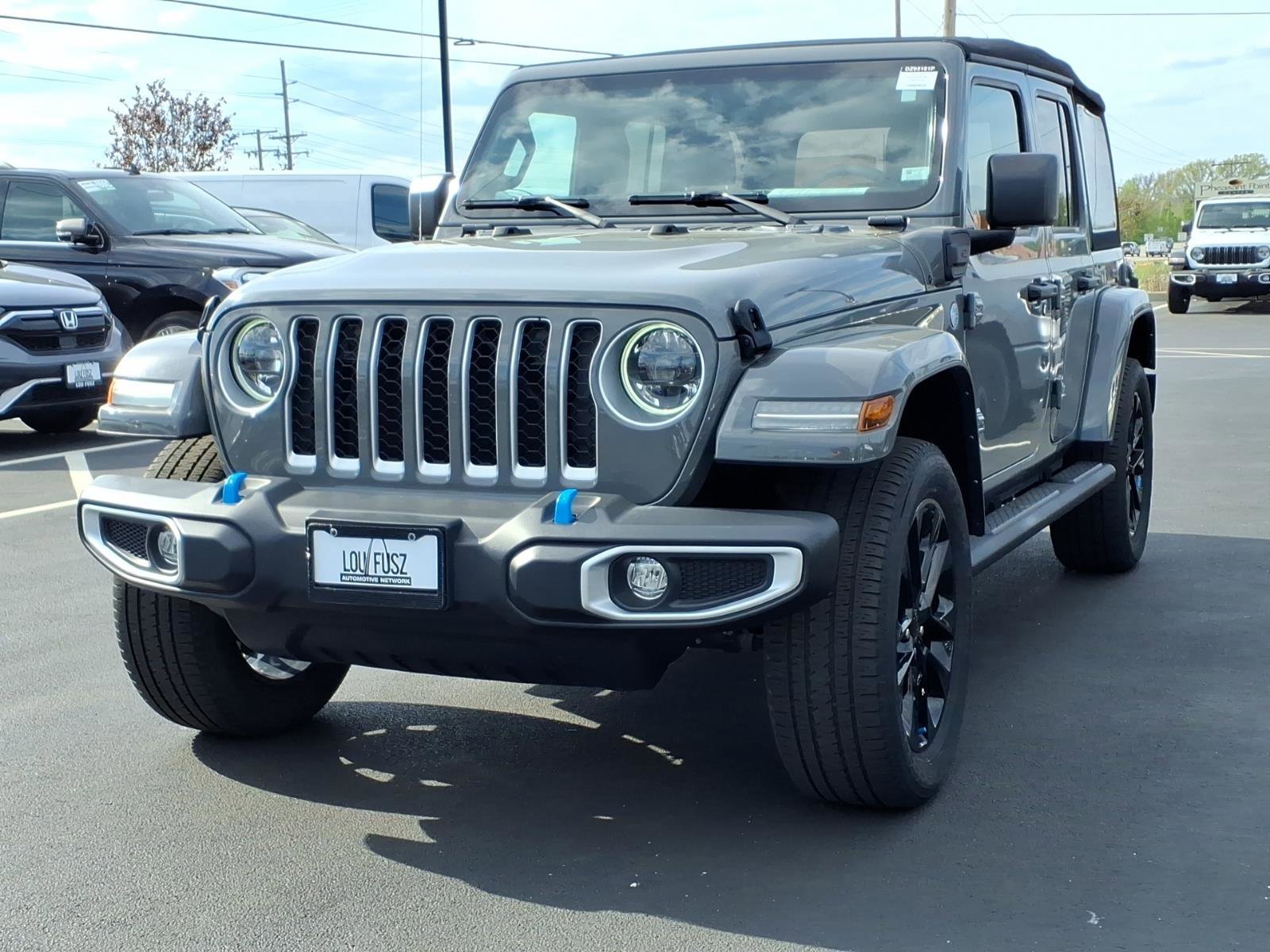 Used 2023 Jeep Wrangler 4xe Sahara 4XE with VIN 1C4JJXP67PW556222 for sale in O'Fallon, MO