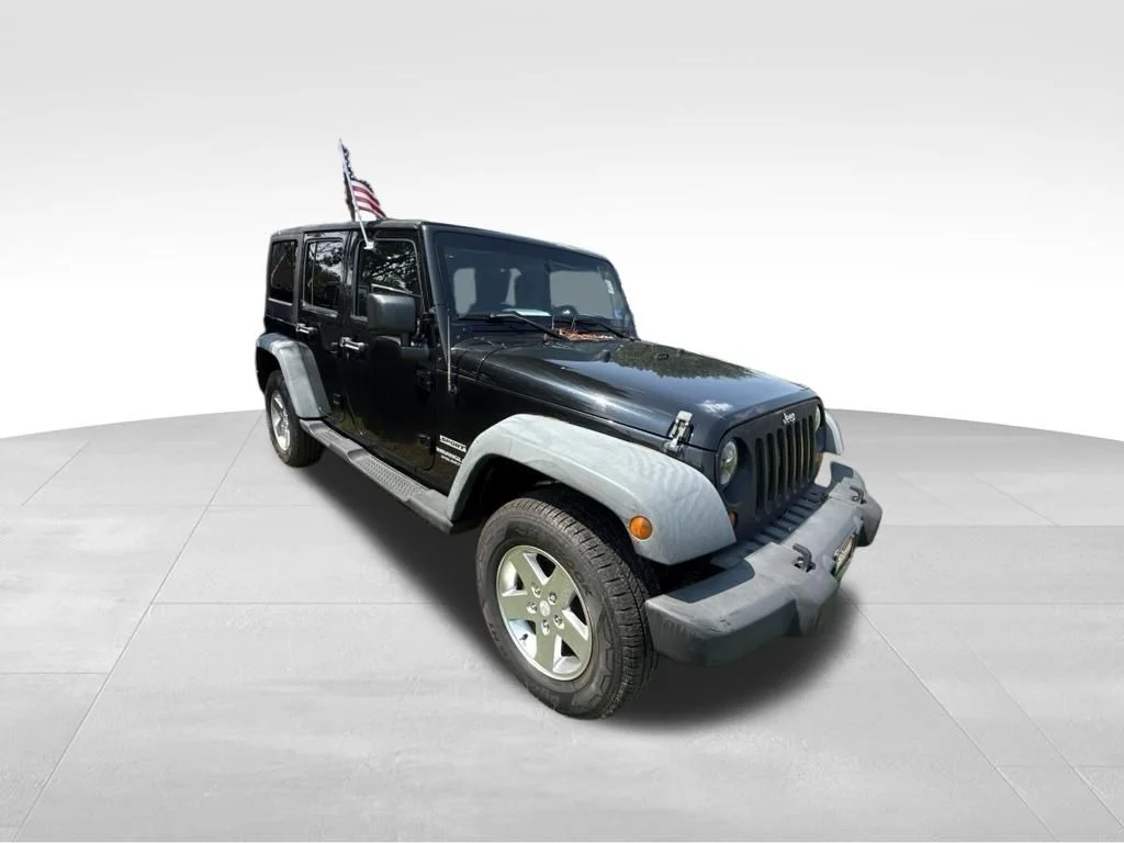 Used 2012 Black Jeep Unlimited Sport image 9