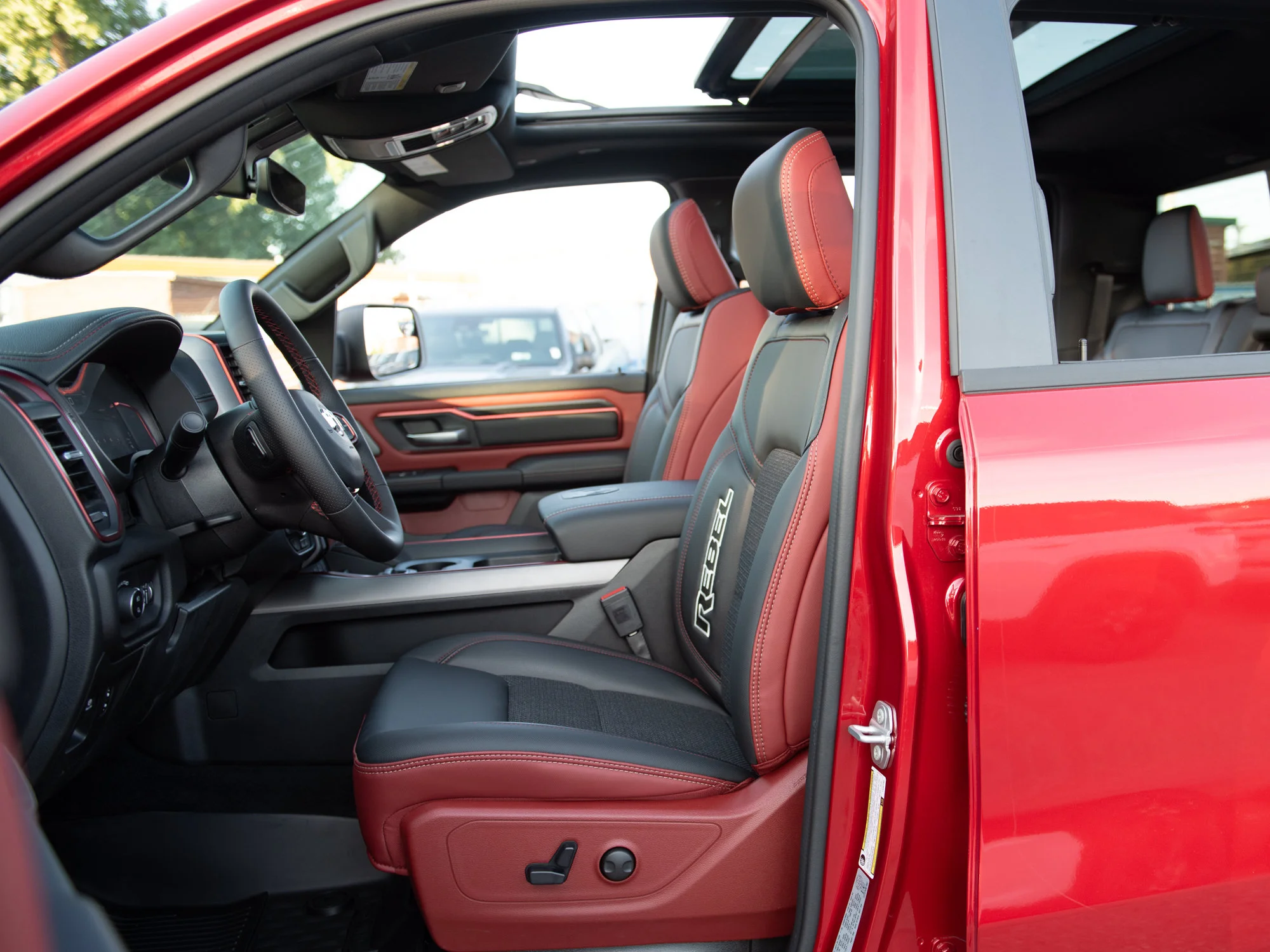 New 2026 Red RAM Rebel* Crew Cab 4x4, Pano Sunroof, 33 Inch A/T Tires, Passenger Screen image 25