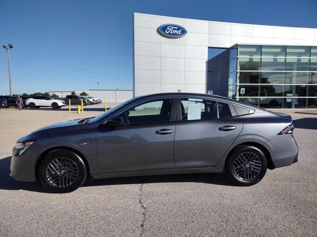 Used 2027 Gun Metallic Nissan SV image 2