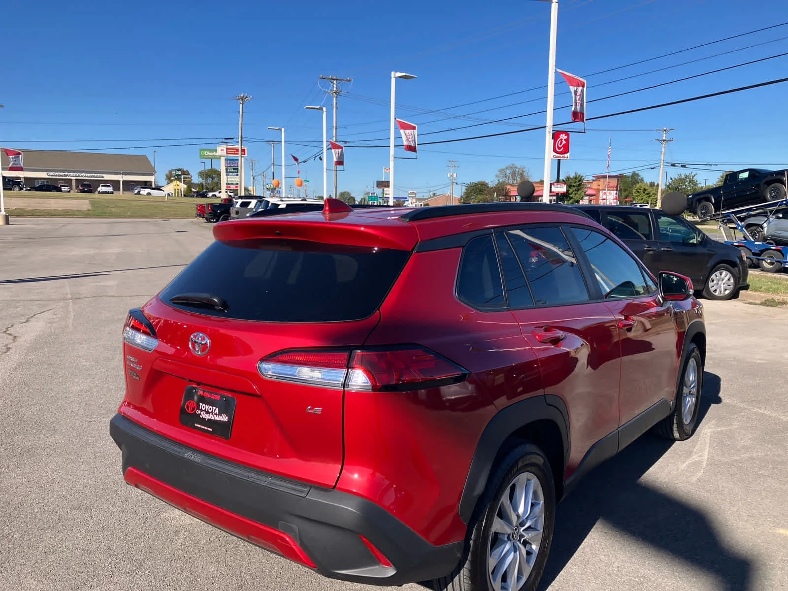 Used 2023 Barcelona Red Metallic Toyota LE image 7