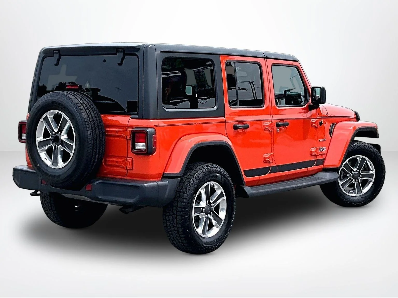 Used 2018 Orange Jeep Unlimited Sahara image 3