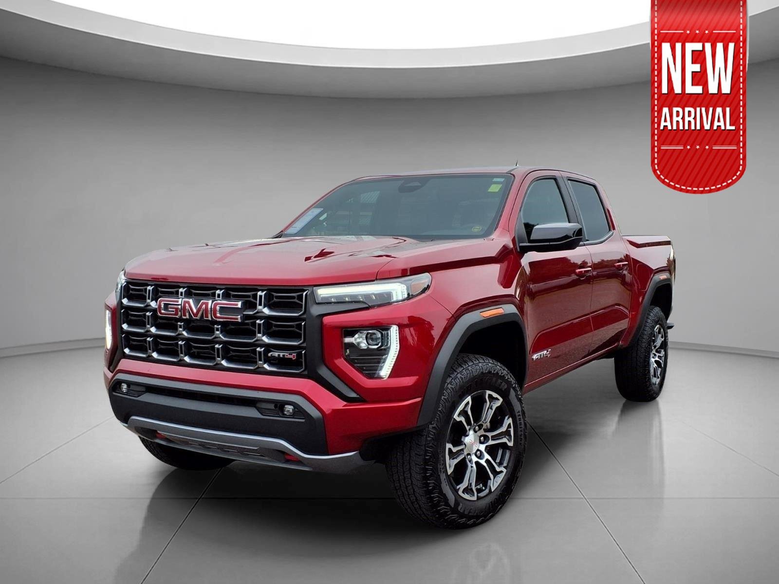 Used 2025 Volcanic Red Tintcoat GMC 4WD AT4 image 1
