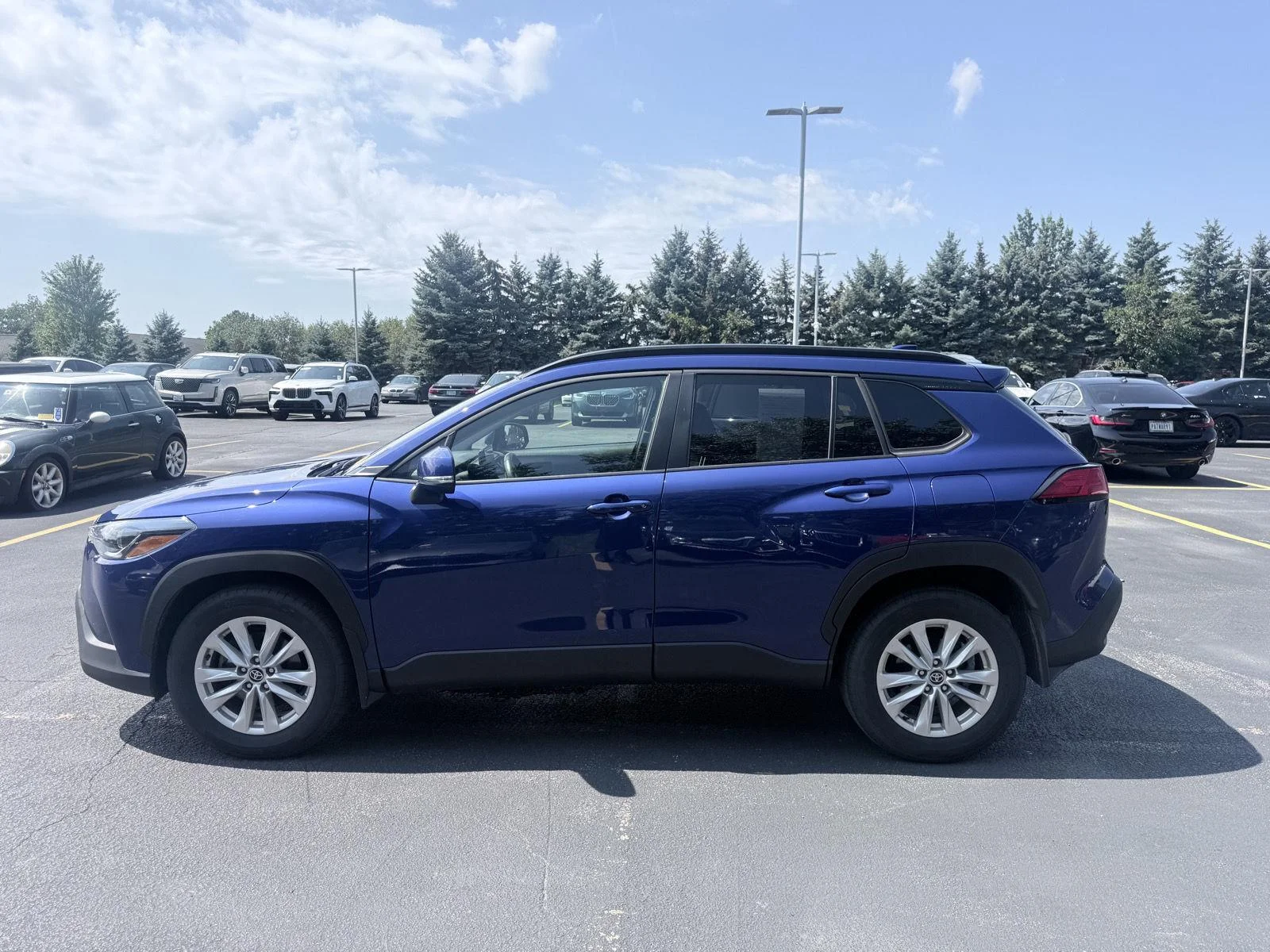Used 2023 Blue Crush Metallic Toyota LE image 4