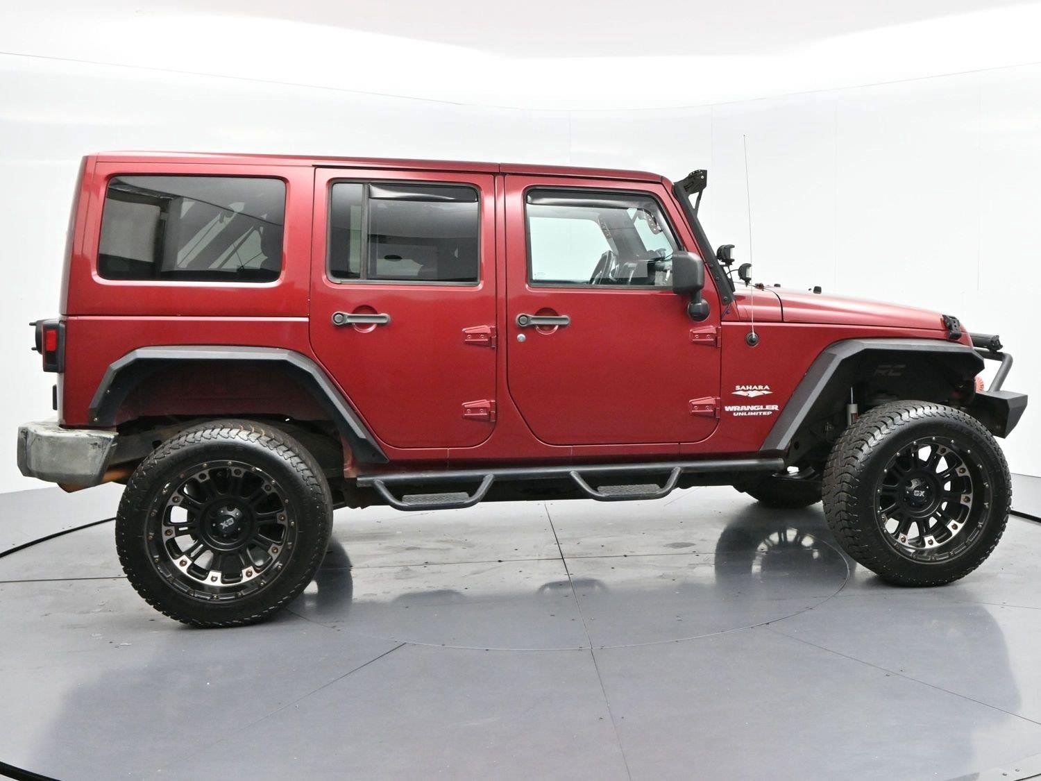 Used 2011 Deep Cherry Red Crystal Pearlcoat Jeep Sahara image 8