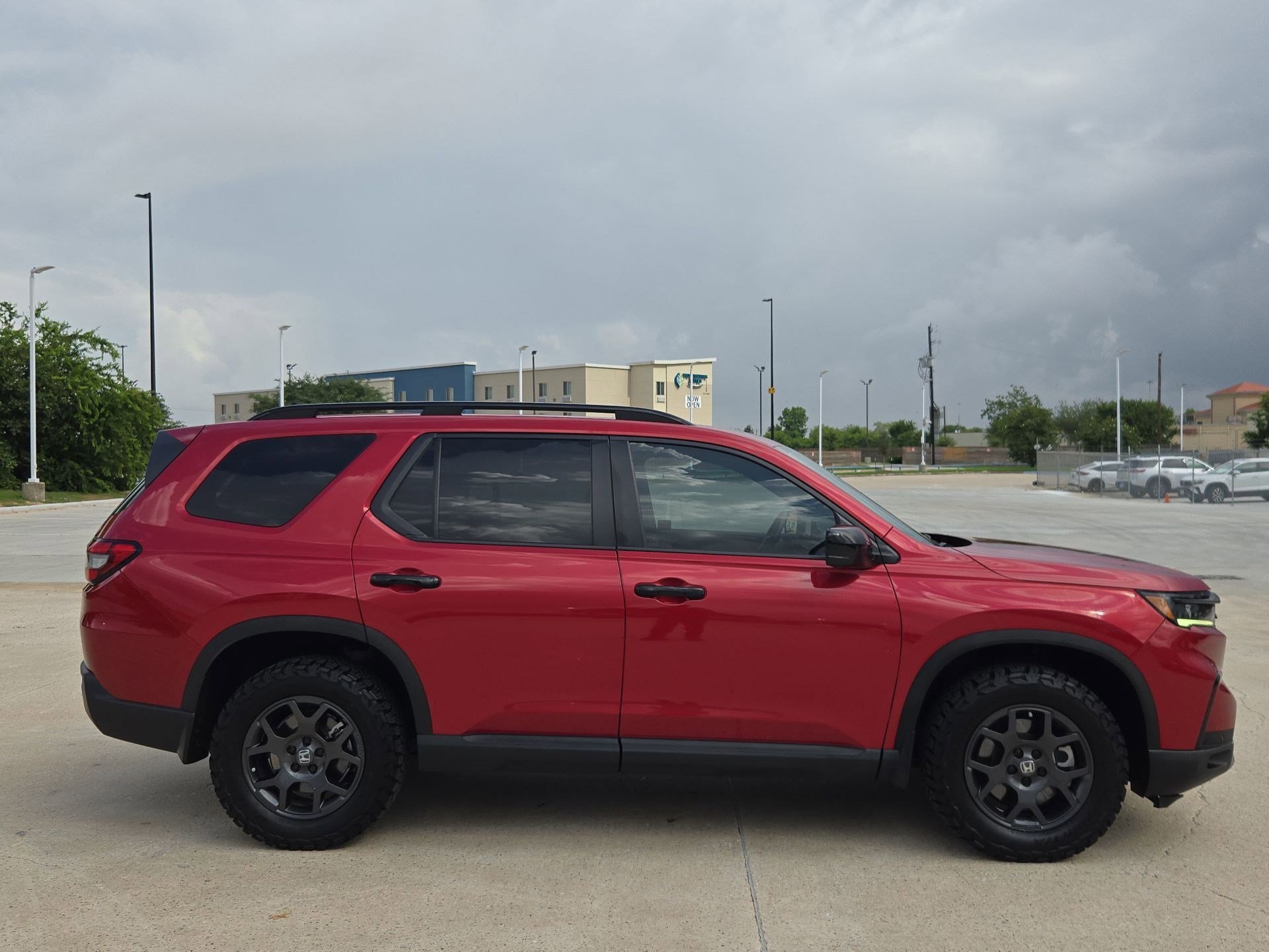 Certified Used 2024 Radiant Red Metallic II Honda AWD TRAILSPORT image 2