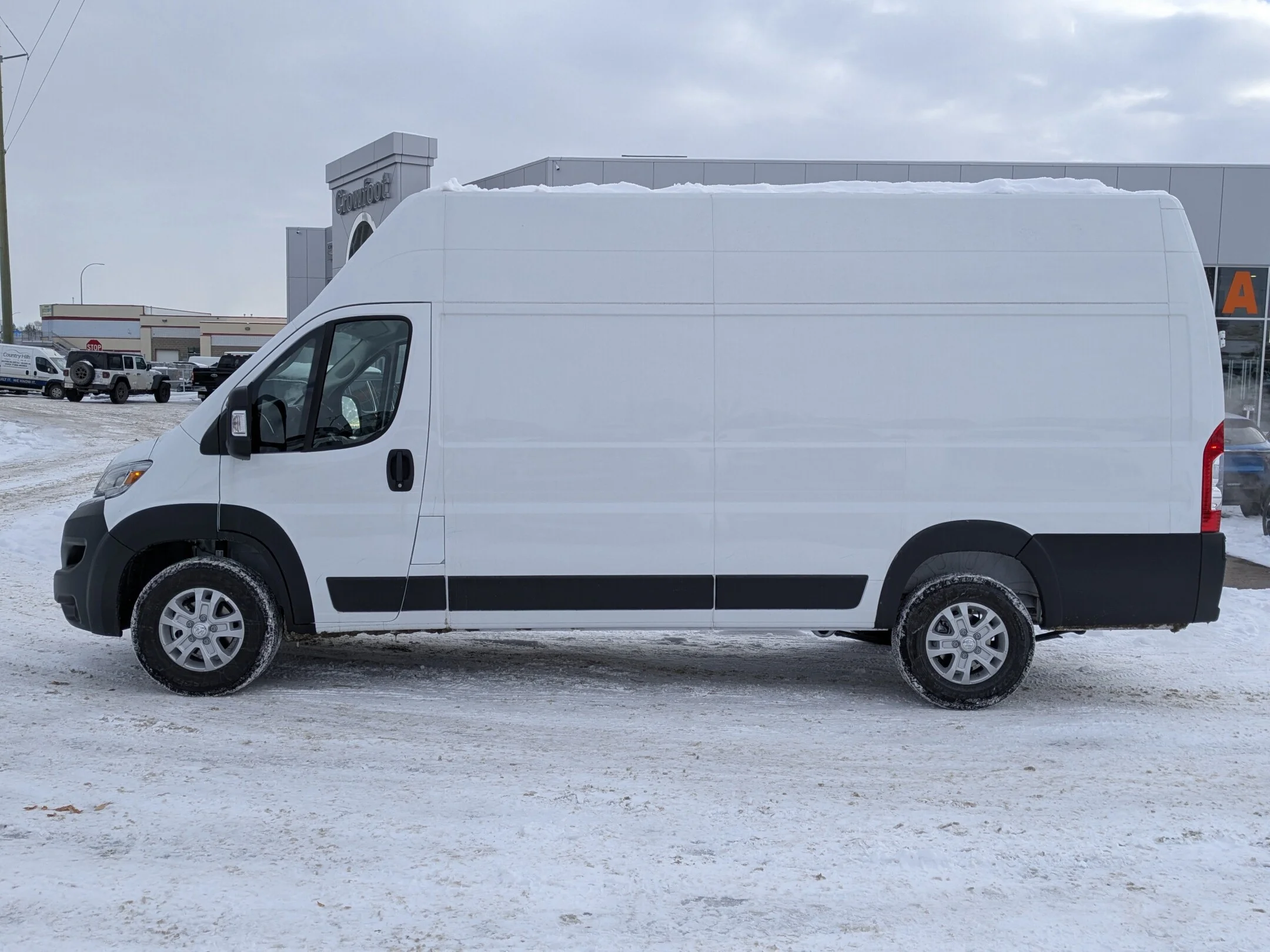 New 2026 White RAM SLT - - FWD - Super High Roof - Package 22G - LED Headlamps - Cargo Partition & More! image 5