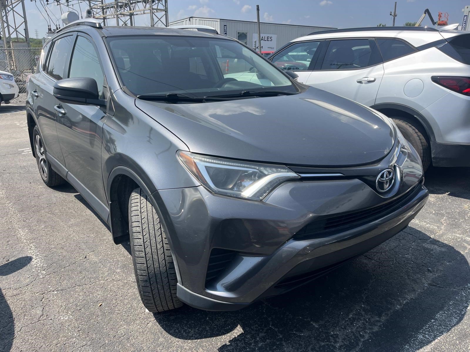 Used 2016 Magnetic Gray Metallic Toyota LE image 1