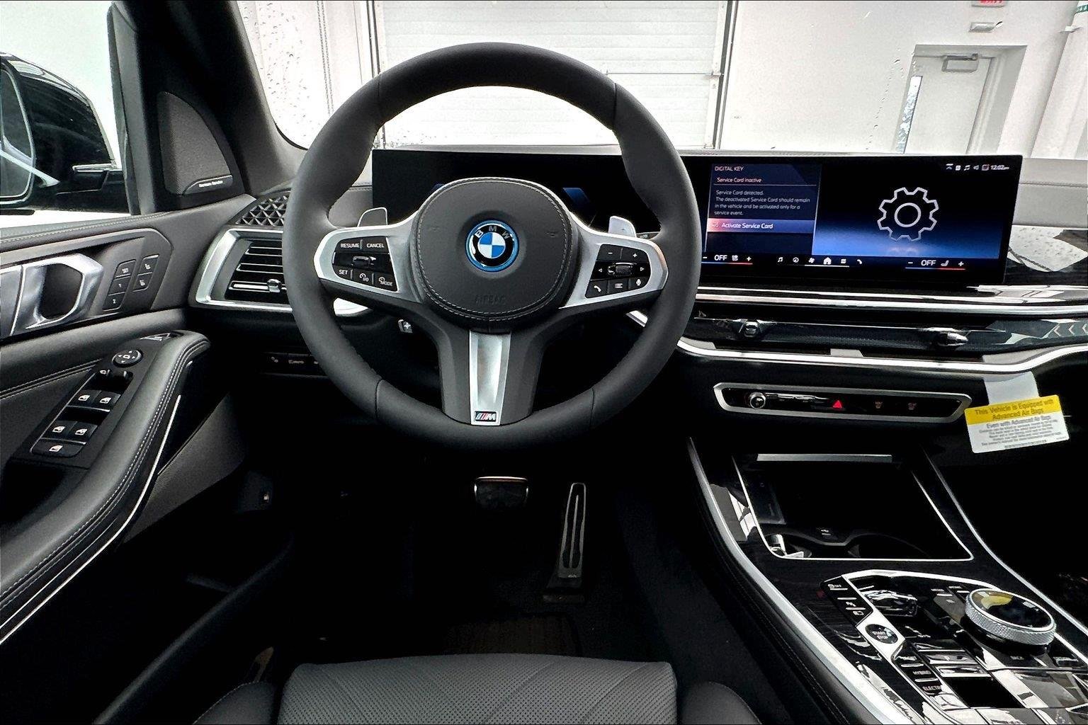 New 2026 Black Sapphire Metallic BMW xDrive50e image 11