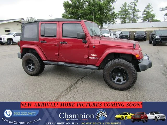 Used 2013 Red Jeep Unlimited Sahara image 3
