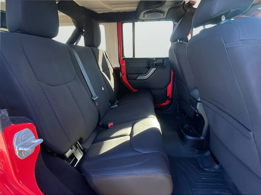 Used 2013 Red Jeep Unlimited Sport image 25
