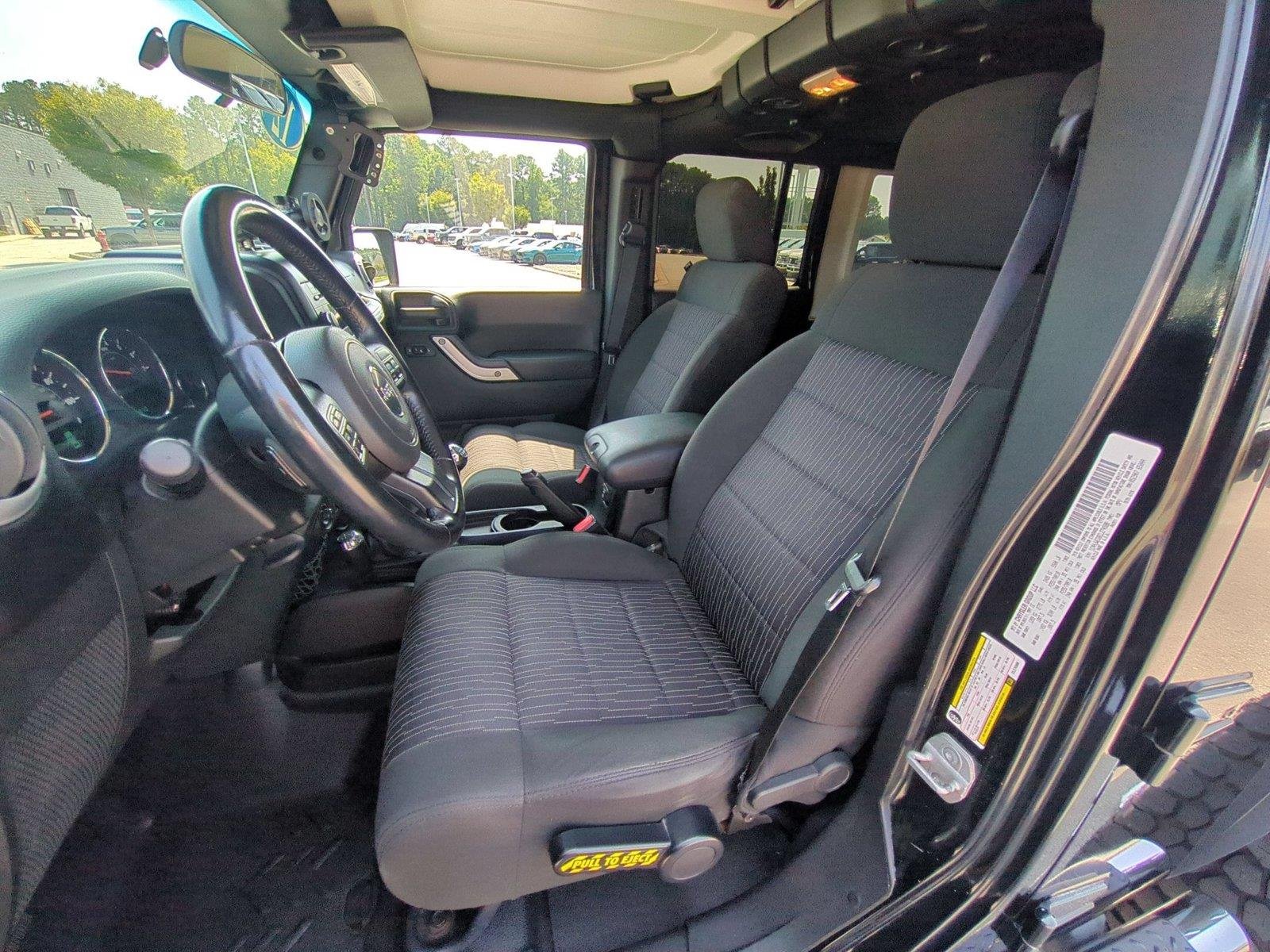 Used 2012 Black Clearcoat Jeep Sahara image 16