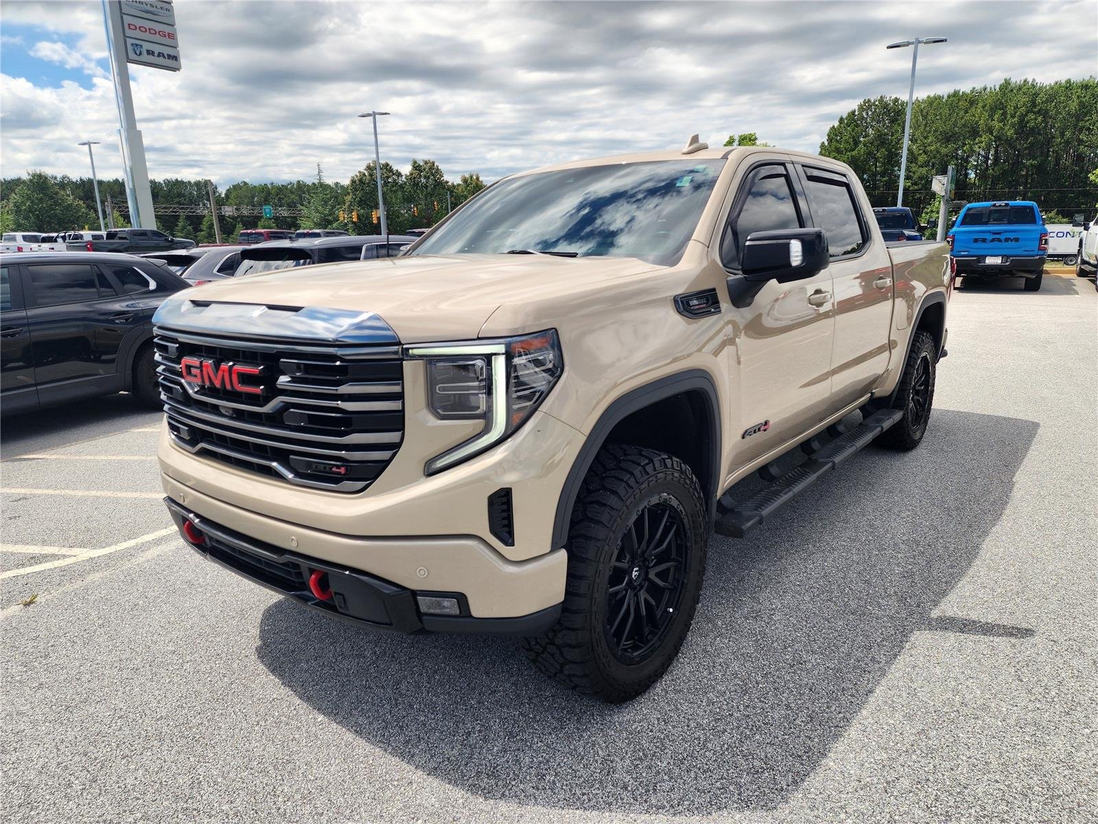 Used 2023 Desert Sand Metallic GMC AT4 image 3