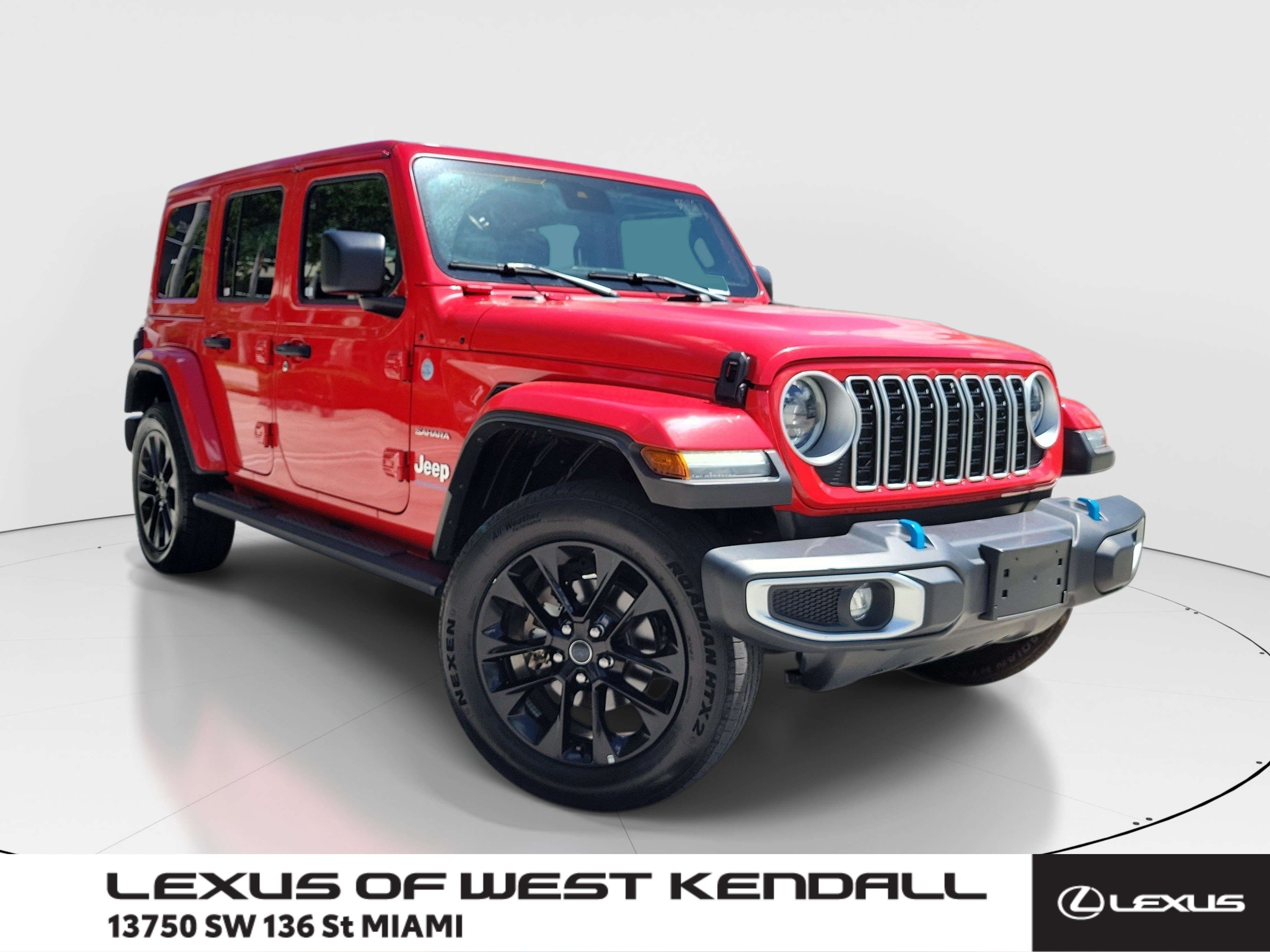 Used 2024 Firecracker Red Clearcoat Jeep Sahara image 1
