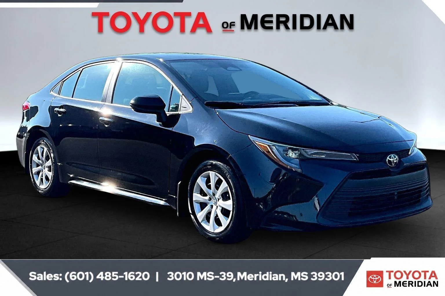 Used 2024 Midnight Black Metallic Toyota LE image 1