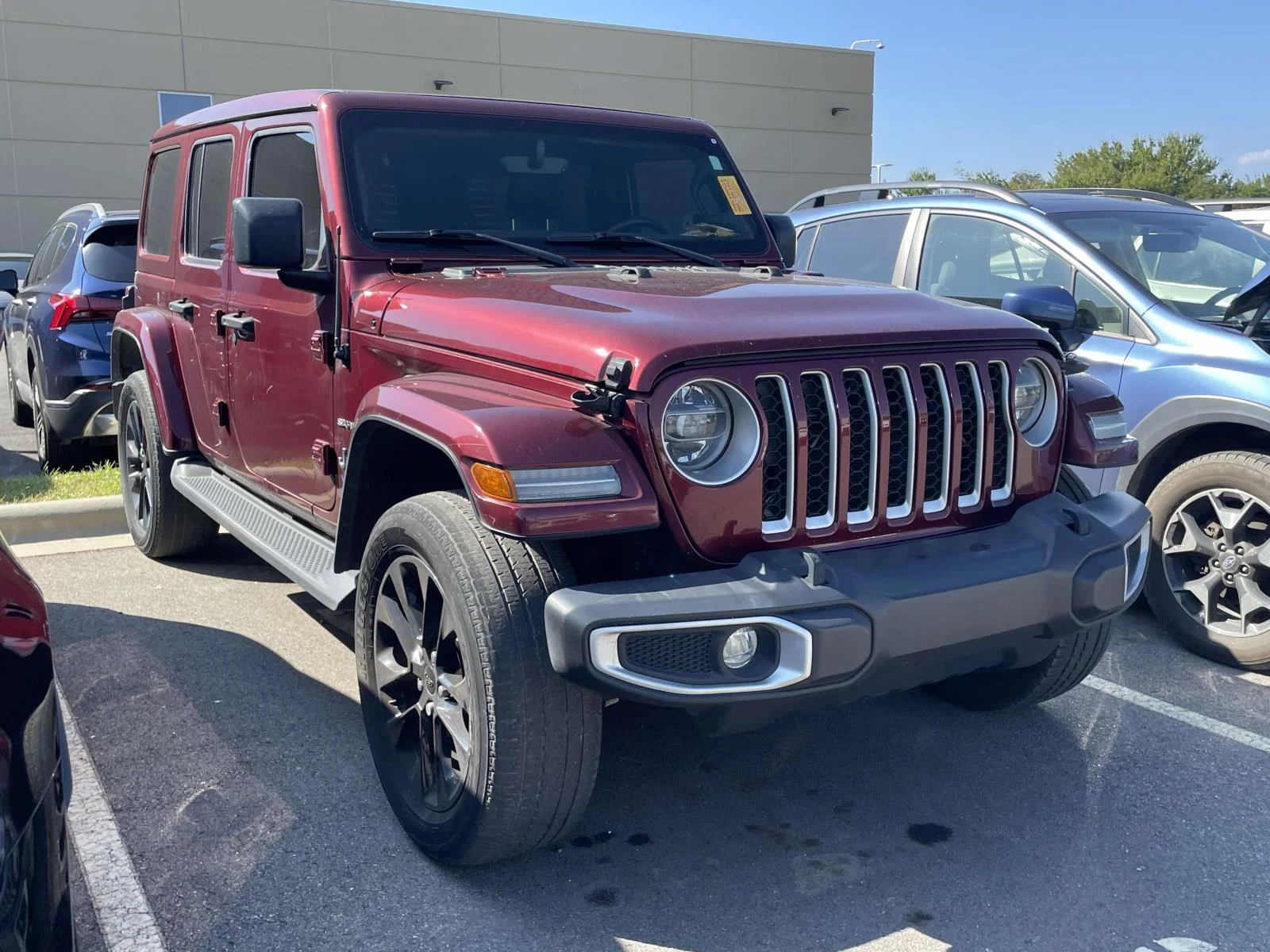 Used 2021 Snazzberry Pearlcoat Jeep Unlimited Sahara image 1