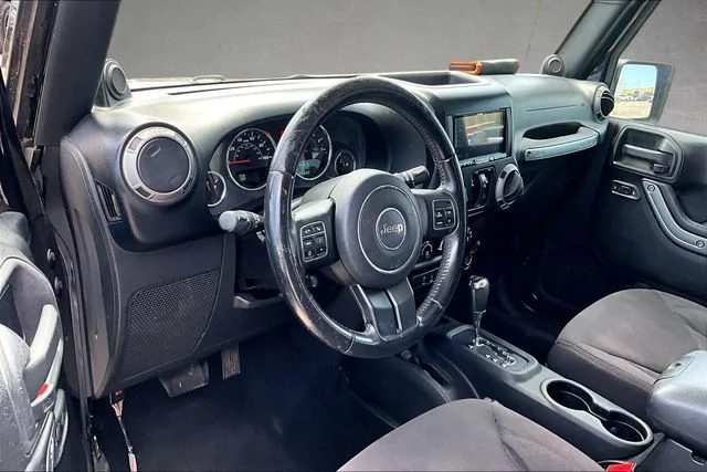 Used 2013 Black Jeep Unlimited Sport image 9