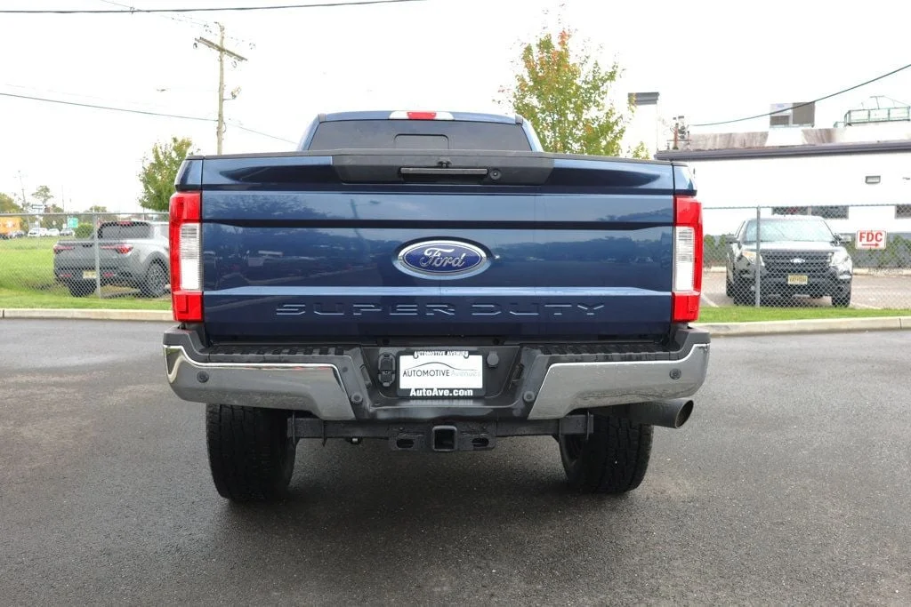 Used 2019 Blue Jeans Metallic Ford LARIAT 4WD Crew Cab 6.75