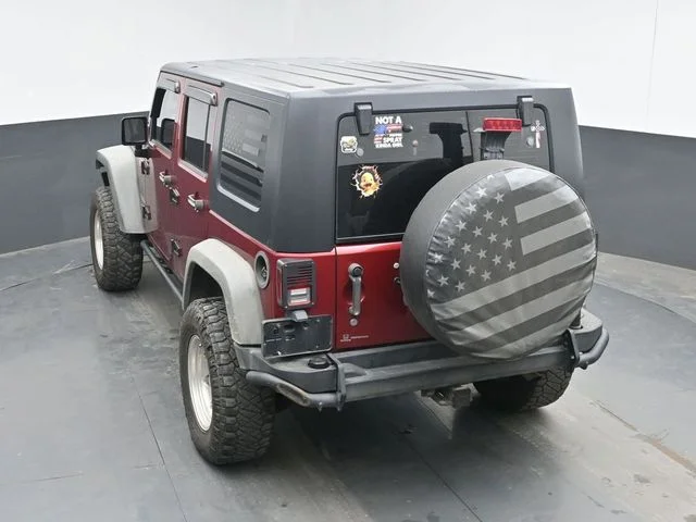 Used 2012 Red Jeep Unlimited Sport image 19