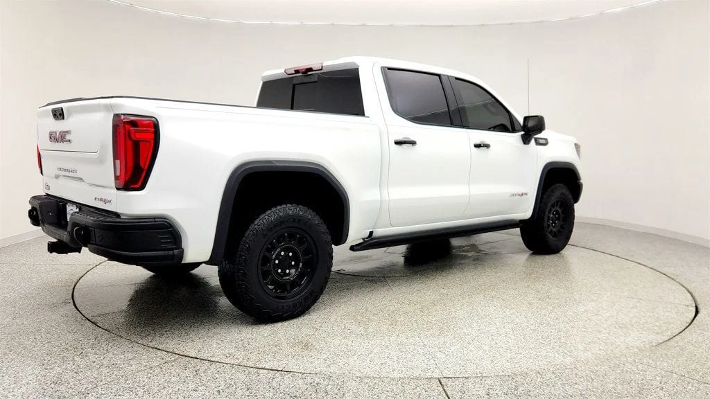 Used 2024 Summit White GMC 4WD Crew Cab 147"" AT4X image 5