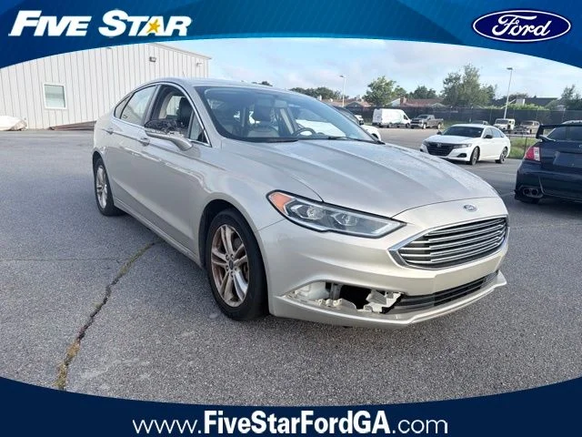 Used 2018 Gold Ford SE image 1