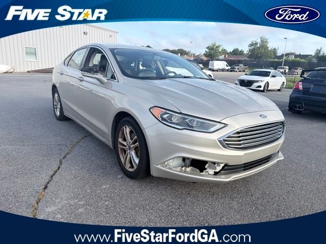 Used 2018 Gold Ford SE image 1