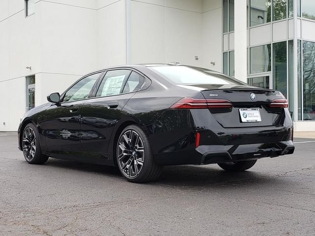 New 2027 Black Sapphire Metallic BMW 550e xDrive image 3
