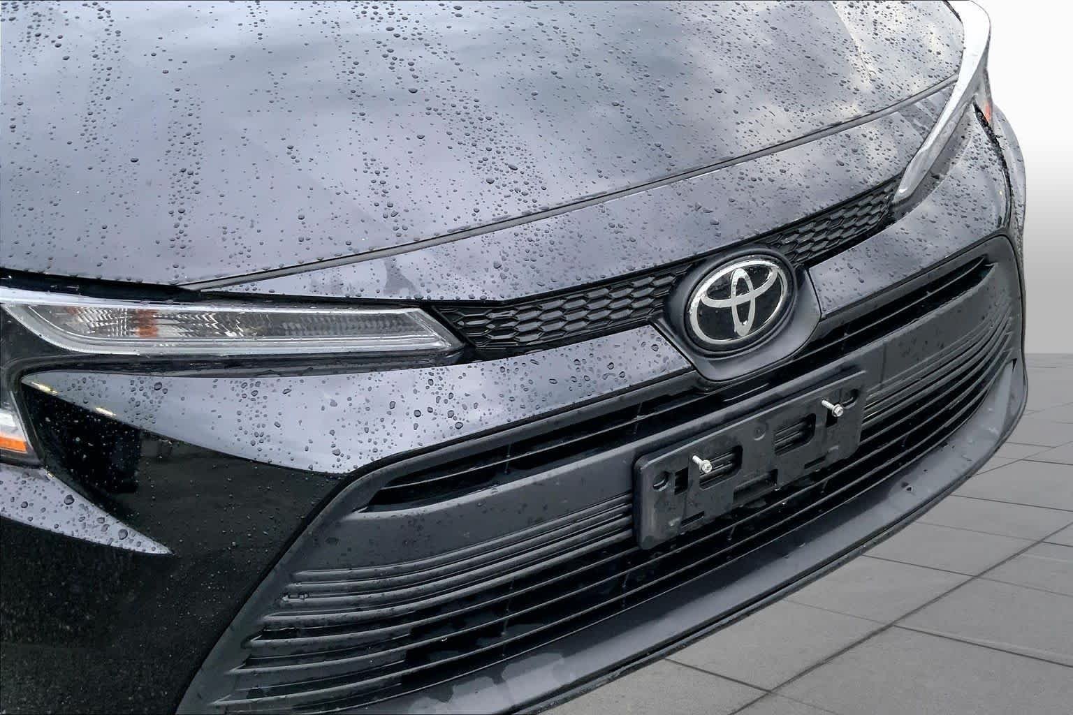 Used 2024 Midnight Black Metallic Toyota LE image 29