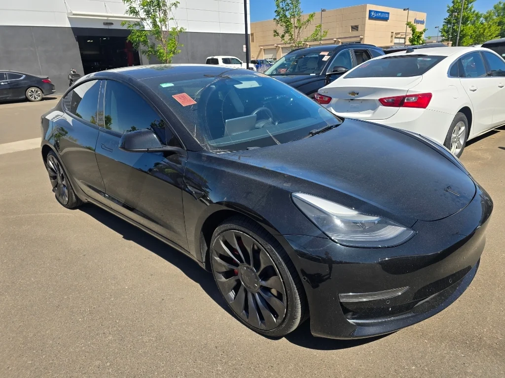 Used 2022 Solid Black Tesla Performance image 7